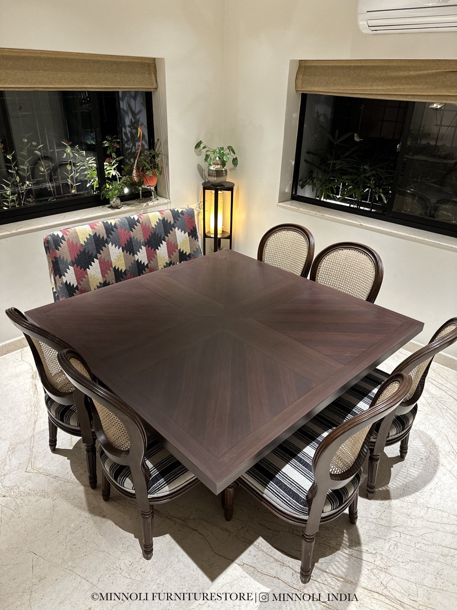 Large custom dining table with sculptural dining chairs