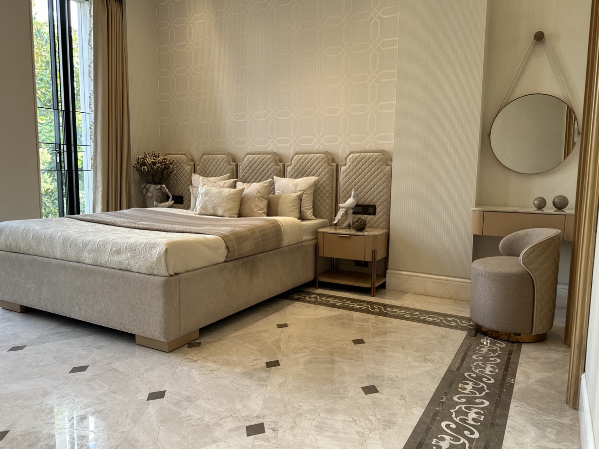 Luxury bedroom with a custom quilted bed and bedside table