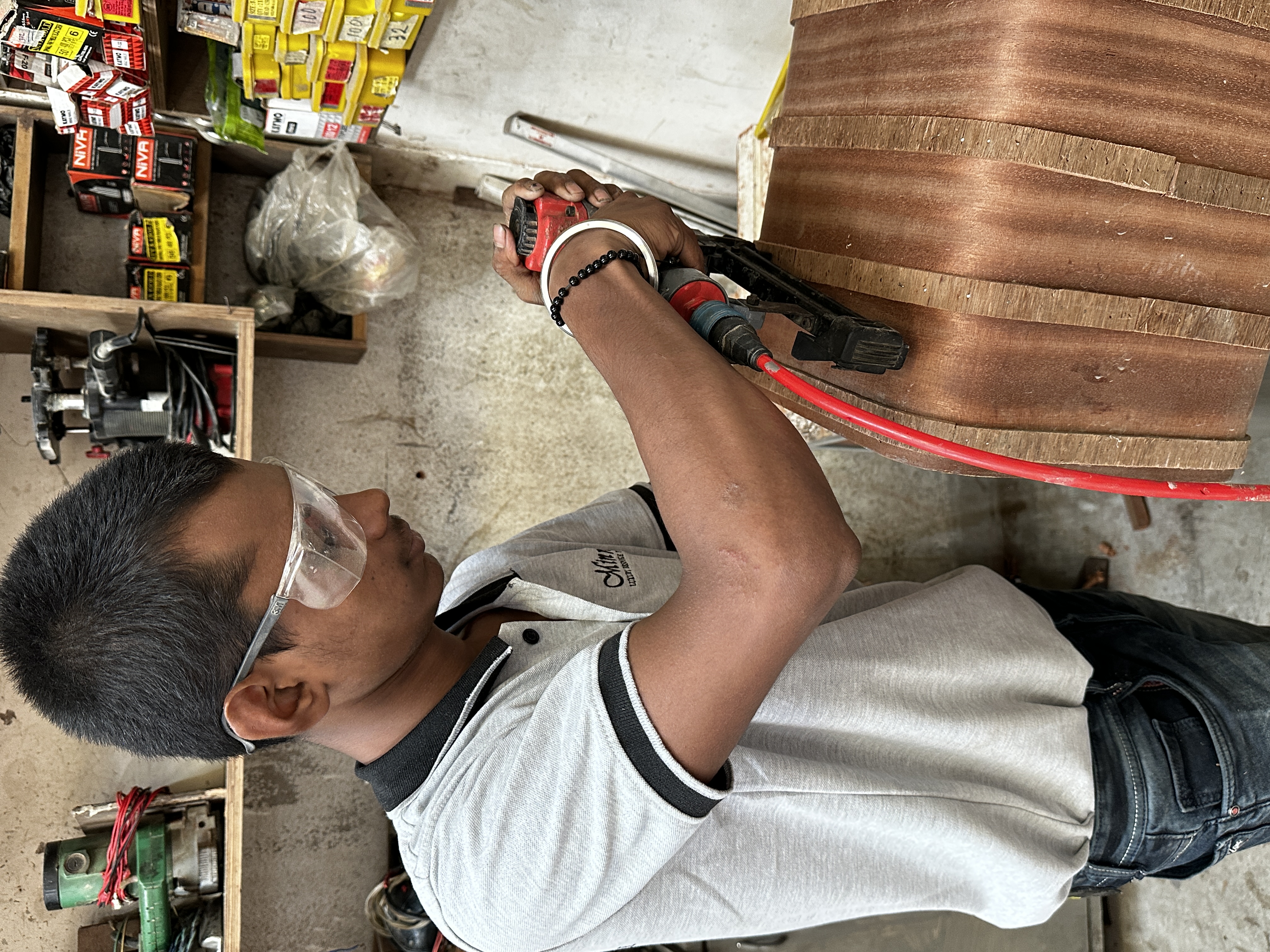 Minnoli craftsman shaping a bespoke furniture detail